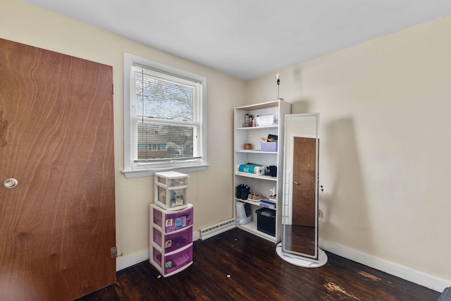 74 Fearing St, Buzzards Bay, MA 02532 - miscellaneous room featuring wood finished floors, baseboards, and a baseboard radiator