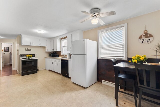 74 Fearing St, Buzzards Bay, MA 02532 - kitchen with freestanding refrigerator, range with electric stovetop, dishwasher, a sink, and a ceiling fan