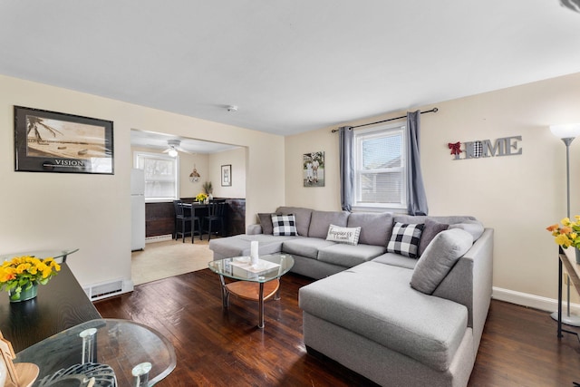 74 Fearing St, Buzzards Bay, MA 02532 - living room with plenty of natural light, wood finished floors, and baseboards