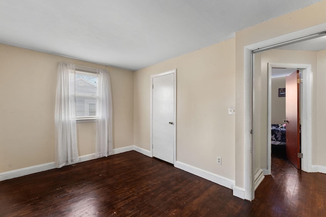 74 Fearing St, Buzzards Bay, MA 02532 - unfurnished bedroom with wood-type flooring and baseboards