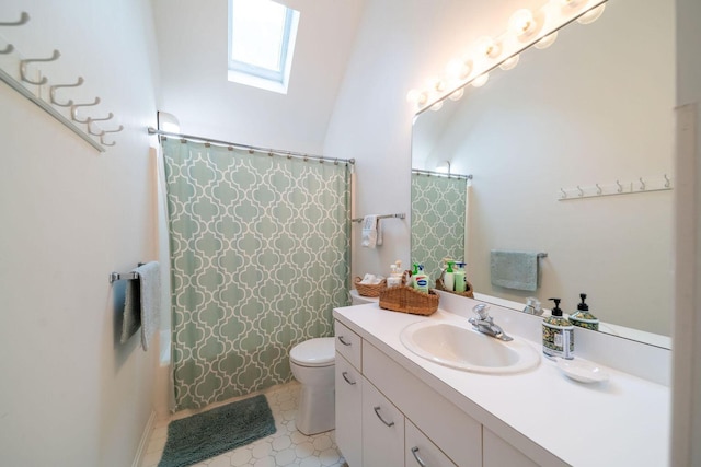 full bathroom with toilet, a skylight, a shower with shower curtain, and vanity