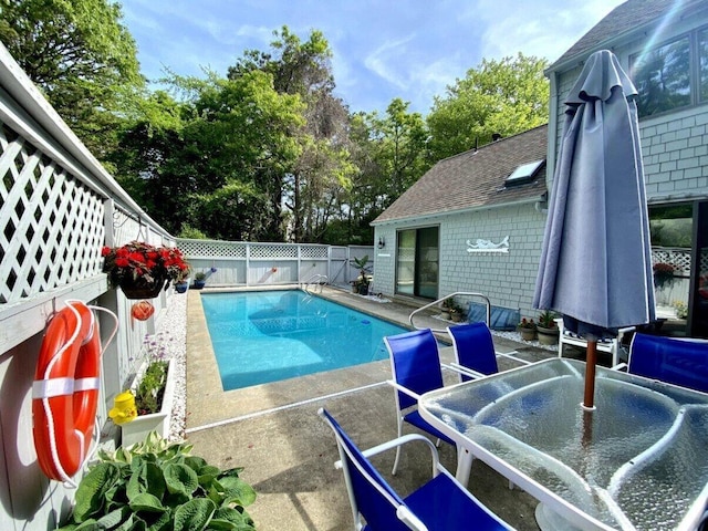 view of pool featuring a fenced in pool, a patio area, and a fenced backyard