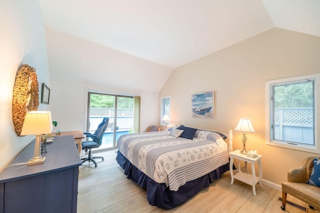 bedroom with access to exterior, light wood-style flooring, baseboards, and vaulted ceiling