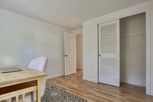 office with light hardwood / wood-style flooring