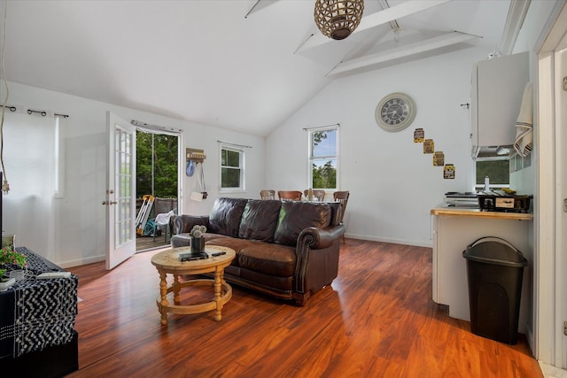452 Nathan Ellis Hwy, Mashpee, MA 02649 - living room featuring wood finished floors, beam ceiling, high vaulted ceiling, plenty of natural light, and ceiling fan