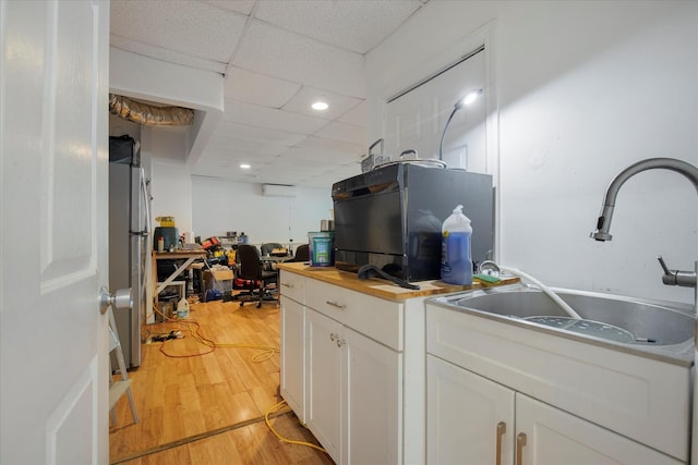 452 Nathan Ellis Hwy, Mashpee, MA 02649 - kitchen featuring butcher block counters, white cabinets, freestanding refrigerator, refrigerator, and light wood finished floors