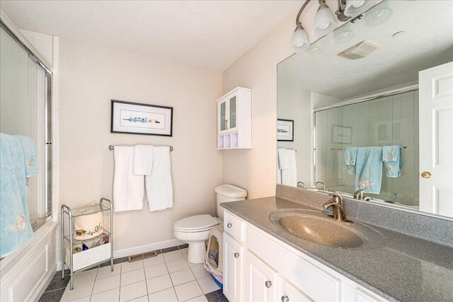 29 Highland Ter Unit 2903, Plymouth, MA 02360 - full bath featuring tile patterned floors, a shower stall, toilet, vanity, and baseboards