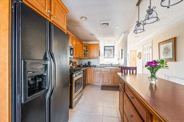 29 Highland Ter Unit 2903, Plymouth, MA 02360 - kitchen with stainless steel appliances, light tile patterned floors, glass insert cabinets, crown molding, and a sink