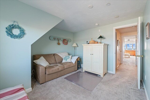 29 Highland Ter Unit 2903, Plymouth, MA 02360 - living room featuring carpet and baseboards