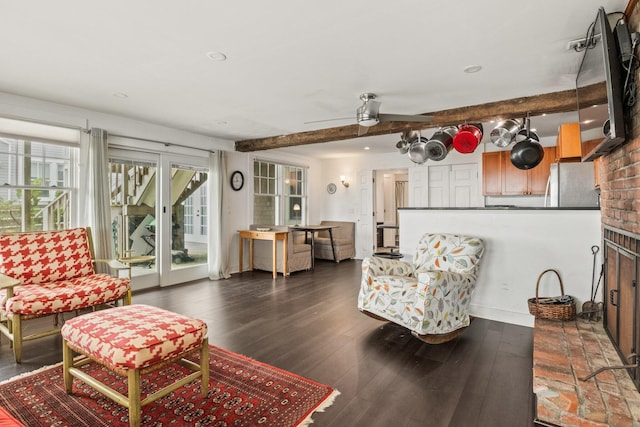 633 Commercial St Unit 2, Provincetown, MA 02657 - living area with a ceiling fan, dark wood-style flooring, a fireplace, and beam ceiling
