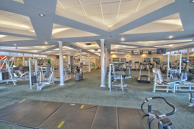 workout area featuring ornate columns