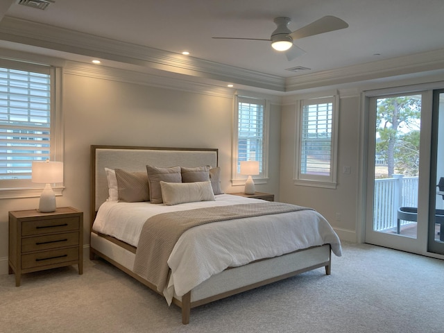 bedroom featuring crown molding, visible vents, light colored carpet, and access to exterior