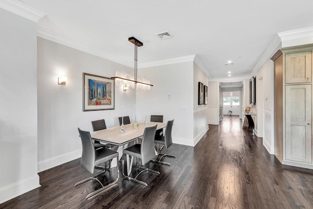 dining space featuring baseboards, visible vents, and dark wood finished floors