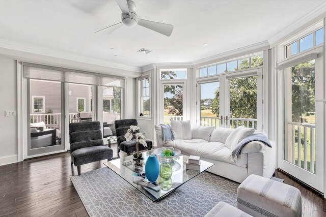 sunroom / solarium featuring french doors, visible vents, and ceiling fan