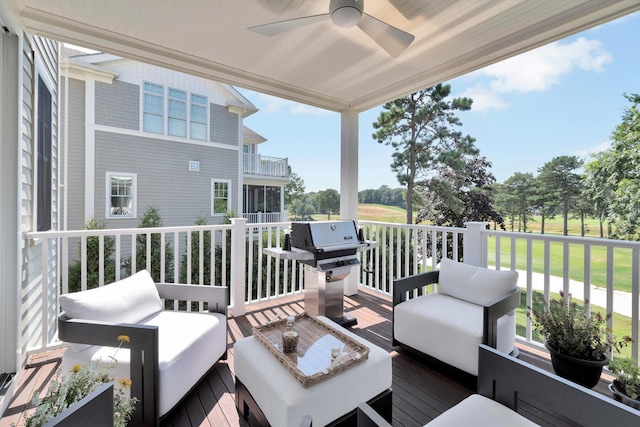 wooden deck with ceiling fan, an outdoor living space, and area for grilling