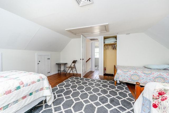 301 Main St, Dennis Port, MA 02639 - bedroom featuring attic access, wood finished floors, and lofted ceiling