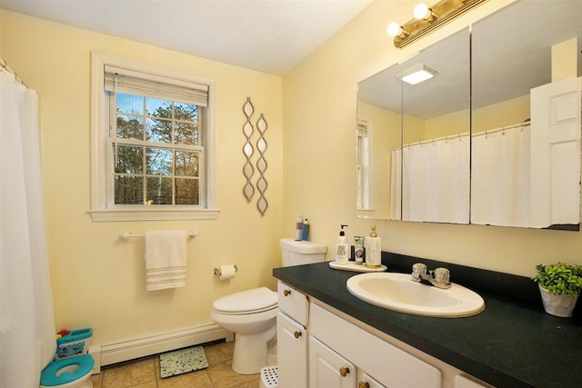 bathroom with vanity, a baseboard radiator, tile patterned floors, and toilet