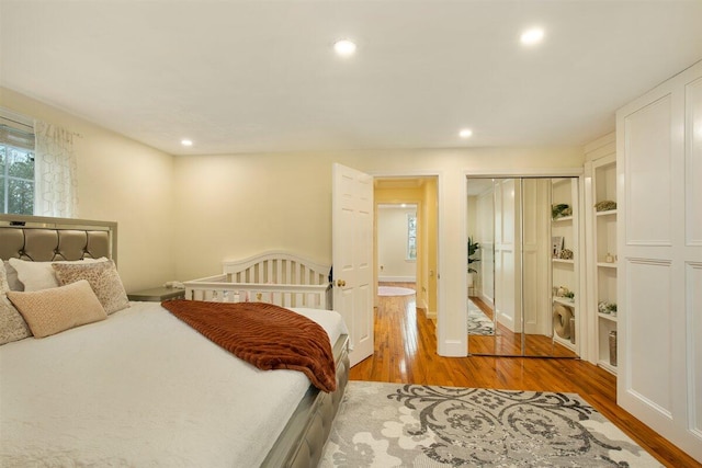 bedroom featuring hardwood / wood-style flooring and a closet