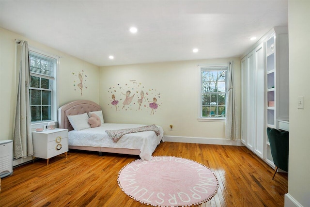 bedroom with light hardwood / wood-style floors