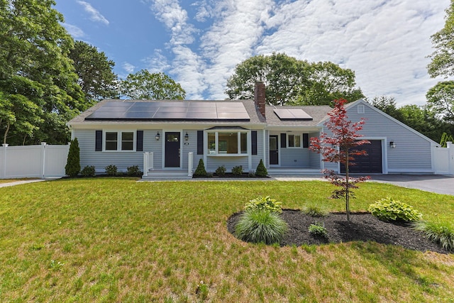 28 Vandermint Ln, Hyannis, MA 02601 - view of front of home featuring asphalt driveway, a garage, roof mounted solar panels, a chimney, and entry steps