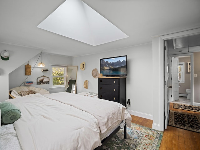 17 Edwards Rd, Hyannis, MA 02601 - bedroom with crown molding, baseboards, a skylight, and wood finished floors