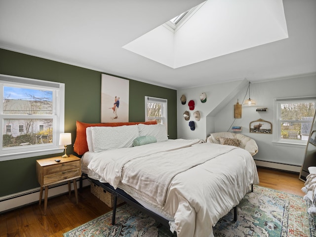 17 Edwards Rd, Hyannis, MA 02601 - bedroom featuring a skylight, crown molding, a baseboard heating unit, and multiple windows