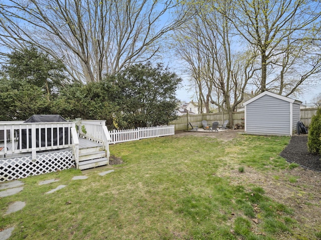 17 Edwards Rd, Hyannis, MA 02601 - view of yard with a storage shed, a deck, a fenced backyard, an outbuilding, and a patio area