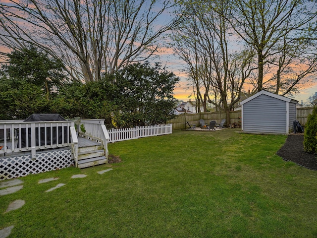 17 Edwards Rd, Hyannis, MA 02601 - view of yard with a fenced backyard, a shed, an outdoor structure, and a deck