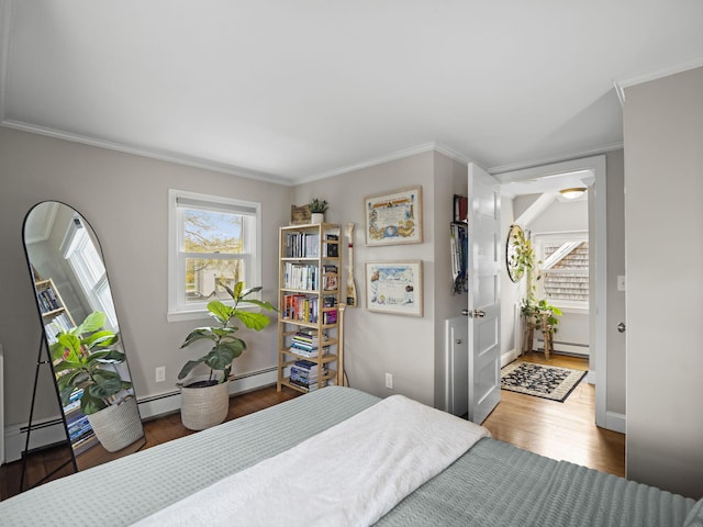 17 Edwards Rd, Hyannis, MA 02601 - bedroom featuring crown molding, baseboard heating, and wood finished floors