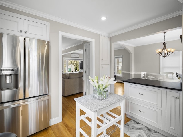 17 Edwards Rd, Hyannis, MA 02601 - kitchen featuring stainless steel fridge with ice dispenser, plenty of natural light, and white cabinetry