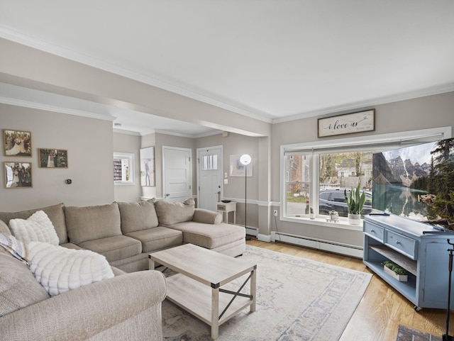 17 Edwards Rd, Hyannis, MA 02601 - living room featuring ornamental molding, baseboard heating, and light wood-style floors