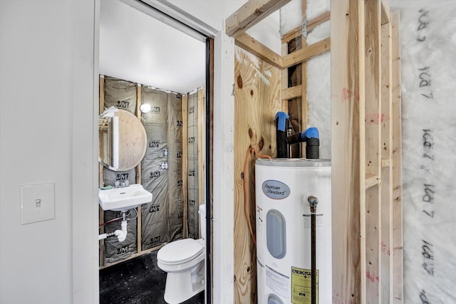 bathroom with sink, toilet, and electric water heater