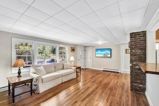 living room with a baseboard radiator and hardwood / wood-style floors