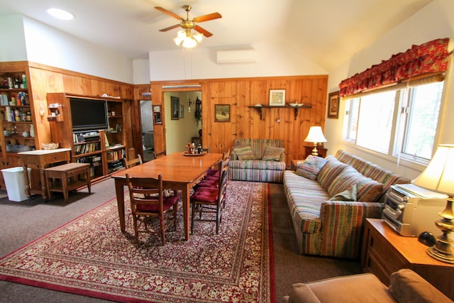 living room with an AC wall unit, carpet floors, wood walls, and ceiling fan