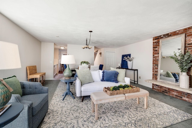 living room with an inviting chandelier and light carpet