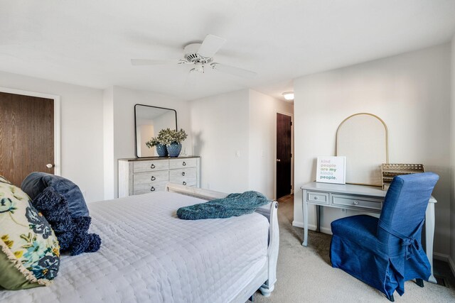 bedroom featuring light carpet and ceiling fan