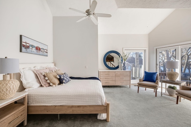 bedroom with dark colored carpet, high vaulted ceiling, and ceiling fan