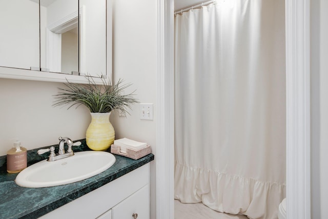 bathroom with vanity and curtained shower