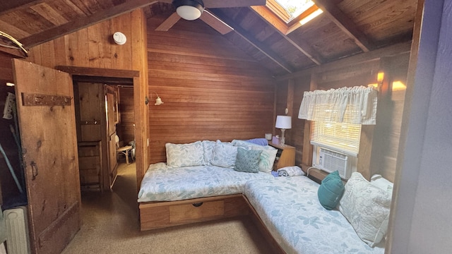 bedroom with carpet floors, wood walls, wood ceiling, and vaulted ceiling with skylight