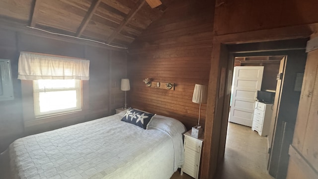 bedroom with wooden walls, wooden ceiling, and vaulted ceiling
