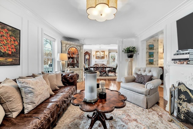 13 Old Colony Way, Provincetown, MA 02657 - living area with a chandelier, ornate columns, wood finished floors, and ornamental molding