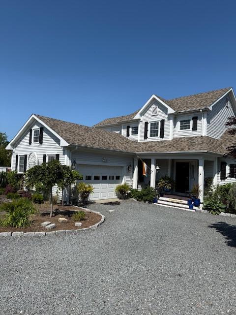 13 Old Colony Way, Provincetown, MA 02657 - view of front of property with a porch, an attached garage, and driveway