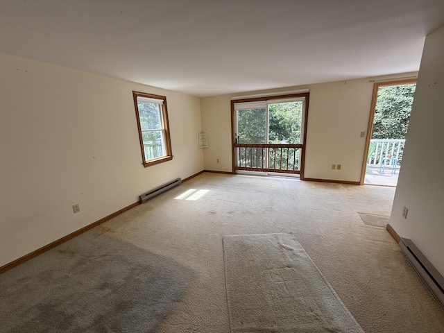 281 Orleans Rd Unit 5, North Chatham, MA 02650 - unfurnished room featuring a baseboard heating unit, healthy amount of natural light, and light colored carpet