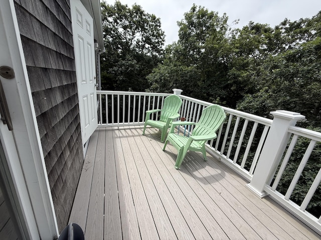 281 Orleans Rd Unit 5, North Chatham, MA 02650 - wooden terrace featuring view of wooded area