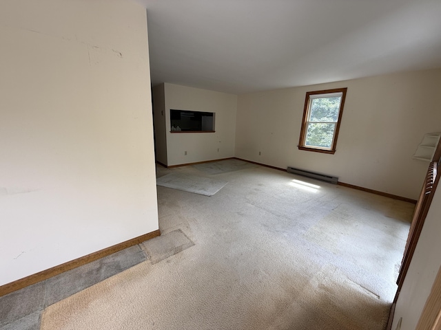 281 Orleans Rd Unit 5, North Chatham, MA 02650 - empty room with a baseboard heating unit and light carpet