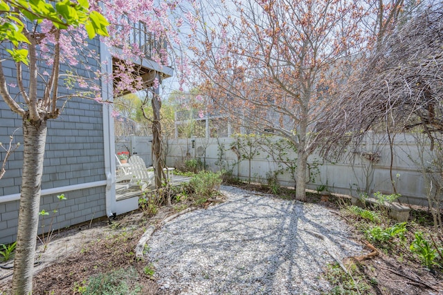 view of yard featuring a patio and a fenced backyard
