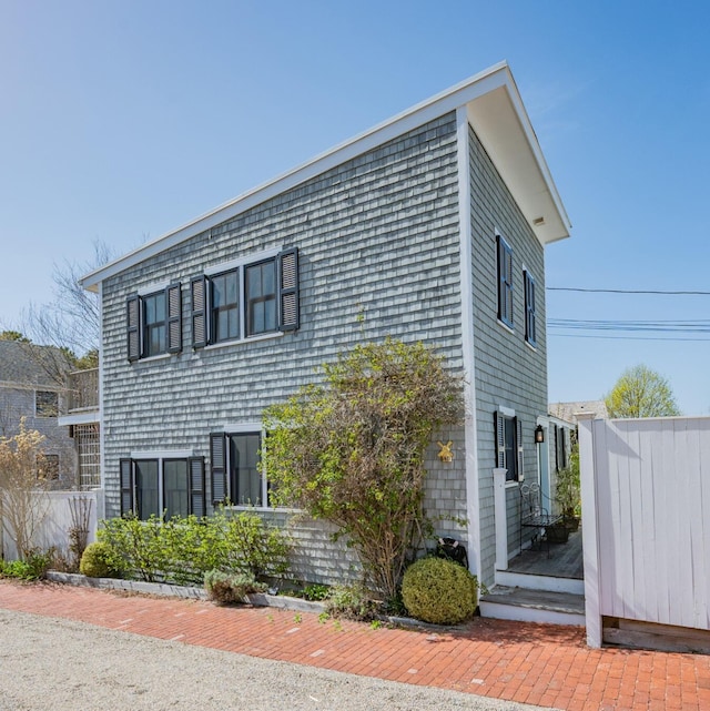 view of home's exterior with fence