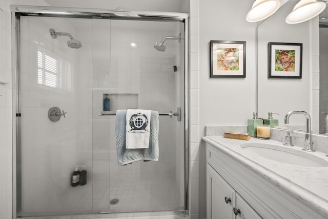 full bath featuring vanity and a stall shower
