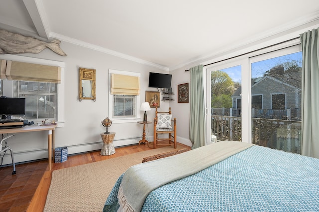 bedroom featuring crown molding, baseboards, and wood finished floors