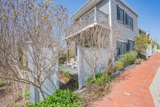 view of side of property featuring a patio area
